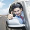 Happy businessman showing thumb up in car