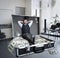 Happy businessman sits in the case full of dollars