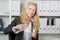 Happy Businesswoman Pouring Water In Glass