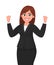 Happy businesswoman showing or raising her fists expressing success gesture. Businesswoman`s emotion and body language concept.