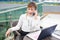 happy businesswoman talking on cell phone in office at home telemarketing
