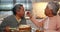 Happy, cake and senior couple in the kitchen eating for tea time and bonding together at home. Love, romance and elderly