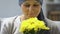 Happy cancer survivor smelling flowers, feels better after chemotherapy, hope