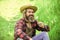 Happy and carefree life. Peace of mind. Rest and relax. Make wish. Peaceful man in straw summer hat. Bearded man blowing