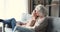 Happy carefree two generations women family relaxing in living room