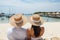 Happy and carefree unrecognizable couple enjoying a beautiful summer day at the beach