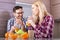 Happy caucasian couple enjoying freshly squeezed orange juice in the kitchen