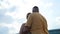 Happy caucasian couple stands hugging outdoors. Video 360.