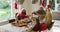 Happy caucasian multi generation family wearing santa hats, having christmas meal, making toast