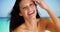 Happy Caucasian young girl at smiling with white teeth at the beach