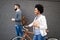 Happy cheerful businesswoman going to work by bicycle