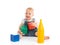 Happy cheerful child playing with blocks cubes on white