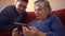 Happy cheerful elderly grandma woman speaking to family on video conference call