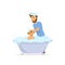 Happy cheerful father washing bathing child in a bathtub