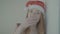 Happy cheerful girl in red santa claus, color profile Slog3