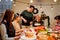 Happy and Cheerful group of extended Asian family talking and smiling during Christmas dinner at home. Celebration holiday