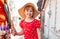 Happy cheerful little school age girl, young child walking by the hand with her mother, outdoors portrait, closeup. Family walk