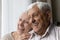 Happy cheerful senior couple looking away candid close up portrait