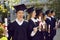 Happy, cheerful university student celebrating and having fun at the graduation ceremony