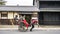 Happy cheerful woman taking photos selfie on phone riding traditional Japanese cart hand pulled rickshaw in Nara, Japan.
