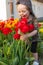 Happy child against spring flowers background. Mothers Day.