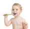 Happy child brushing teeth isolated