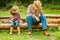 Happy child with cowboy parent in nature in the field