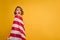 Happy child, cute girl with American flag on yellow studio background. USA celebrate July 4th, independence Day.