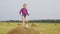 Happy child dancing on haystack