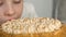 Happy child eating delicious dessert. close-up of a caucasian preschool child trying a cream birthday cake. Selective focus. Child