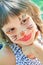 Happy child with funny painted face