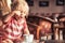 Happy child girl drinking tea in classic traditional English interior restaurant