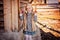 Happy child girl with easter chicken near country house