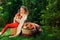 Happy child girl harvesting apples in autumn garden. Seasonal outdoor rural activity