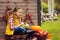 Happy child girl picking fresh apples on the farm. Country living concept, cozy seasonal decorations