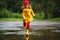 Happy child girl with rubber boots runs in puddle on autumn wal