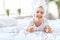 Happy child girl in towel with mask on face