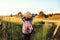 Happy child girl walking on summer countryside. Rural living, exploring new places