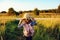 Happy child girl walking on summer countryside. Rural living, exploring new places