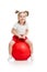Happy child jumping on bouncing ball