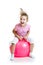 Happy child jumping on bouncing ball isolated