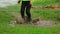 Happy Child Jumping In Muddy Puddle