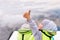 Happy child in lifejacket on the boat showing good. Ok gesture thumb up gunny happy boy. Closeup photo