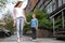 Happy child and mother holding hands outdoors, low angle view