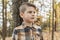 Happy child pensive in the outdoors autumn park