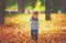 Happy child playing pilot aviator outdoors in autumn