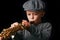 Happy child plays saxophone in studio