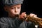 Happy child plays saxophone in studio