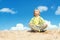 Happy Child Positive Think, Boy Sitting in Yoga Lotus position over blue sky on the top. Kid Happiness concept.