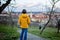 Happy child, preteen boy, visiting spring park in Prague, walking at sunset